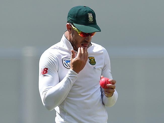 Former South African captain Faf du Plessis uses saliva to shine the ball