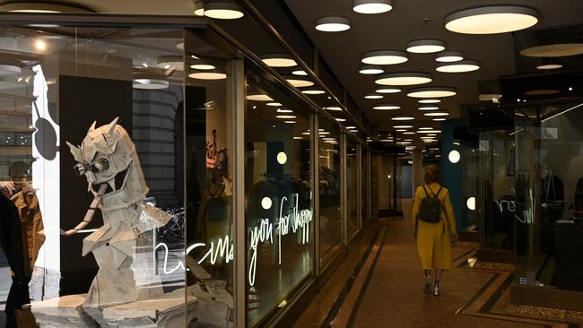 A woman walks in an empty shopping area in the city of Munich. Picture: AFP