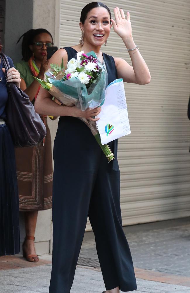 The young mum rocked a black jumpsuit for the visit. Picture: MATRIX.