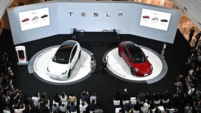 The Tesla Model Y, left, and the Tesla Model 3, right, electric cars are unveiled during Tesla's official launch event in Bangkok earlier this month. Picture: AFP