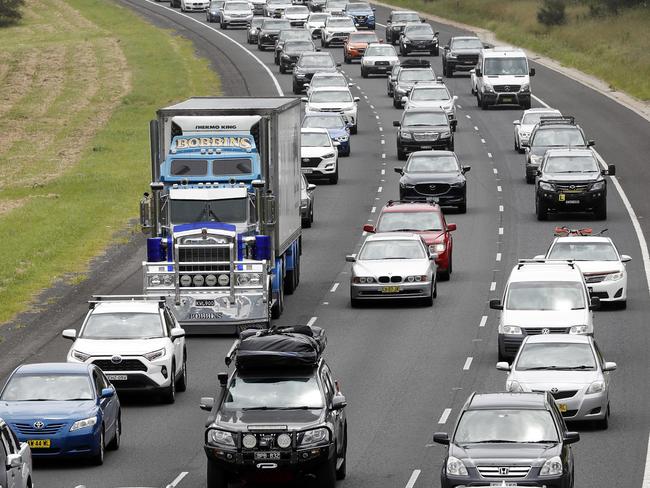 DAILY TELEGRAPH DECEMBER 27, 2021. Slow holiday traffic leaving Sydney southbound on the Hume Motorway near Campbelltown. Picture: Jonathan Ng