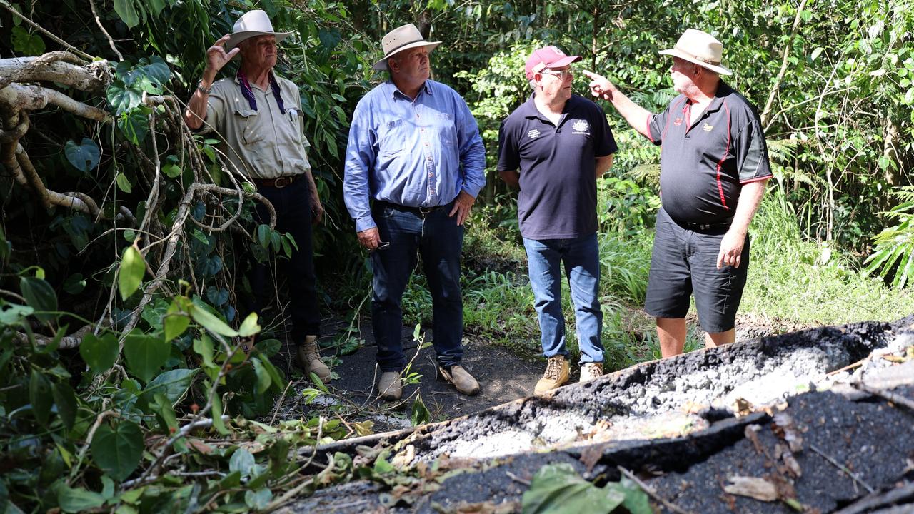 Kennedy MP Bob Katter, Hill MP Shane Knuth, federal emergency management and agriculture minister Murray Watt and trucking company boss Les Blennerhassett of Blenners inspect damage to the Palmerston Hwy following heavy rainfall in the Far North in December 2023.