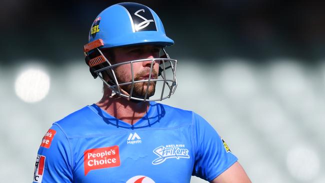 ADELAIDE, AUSTRALIA - JANUARY 24: Travis Head  of the Strikers out off the bowlers hand during the Big Bash League match between the Sydney Thunder and the Adelaide Strikers at Adelaide Oval, on January 24, 2021, in Adelaide, Australia. (Photo by Mark Brake/Getty Images)