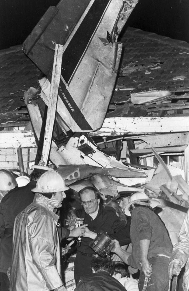 Rescuers assist the injured at the scene of the Airport West plane crash in July 1978. Picture: News Corp Australia