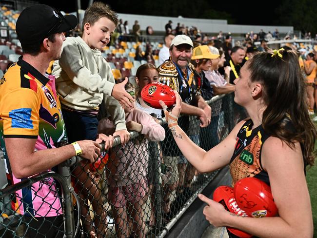 Courtney Jones of the Tigers with supporters after the round eight AFLW match between Hawthorn Hawks and Richmond Tigers at Cazaly's Stadium, on October 20, 2023, in Cairns, Australia. (Photo by Emily Barker/Getty Images)