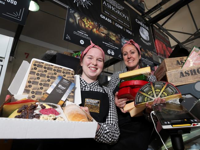 Jess Wall and Anne Bennett from Ashgrove Cheeses putting the finishing touches on their stall at the Taste of Tasmania Picture: Luke Bowden