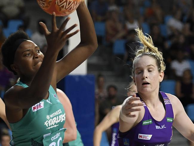CAIRNS, AUSTRALIA - SEPTEMBER 20: Mwai Kumwenda of the Vixens contests the ball with Tara Hinchliffe of the Firebirds during the round 13 Super Netball match between the Melbourne Vixens and the Queensland Firebirds at the Cairns Pop Up Arena on September 20, 2020 in Cairns, Australia. (Photo by Ian Hitchcock/Getty Images)
