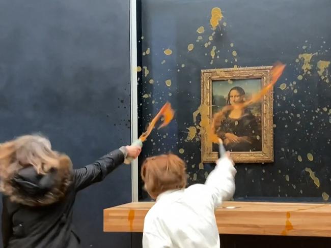 Environmental activists from “Riposte Alimentaire” throw soup at the Mona Lisa’s bulletproof glass in Paris’ Louvre museum, advocating for “healthy and sustainable food”. The artwork remains unharmed due to its protective casing. Picture: David Cantiniaux/AFP