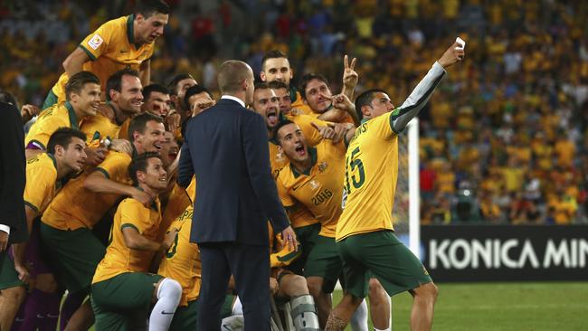 Tim Cahill takes a selfie of the team after the Socceroos’ Asian Cup triumph.