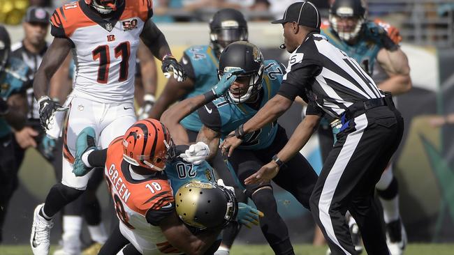 Cincinnati Bengals wide receiver A.J. Green takes down Jacksonville Jaguars cornerback Jalen Ramsey during a fight.