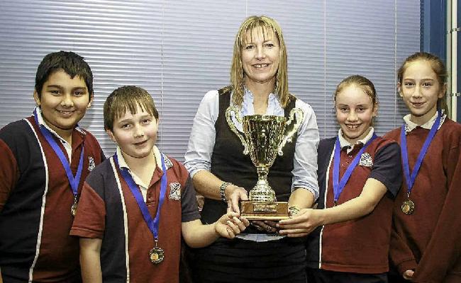 Adam Nisha, Daniel Tynan, Georgia Browning and Georga Tumata with librarian Lea-anne Weier after last weeks Readers Challenge.