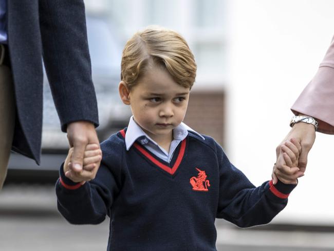 Prince George looks uncertain as he is dropped off at Thomas’s at Battersea. Picture: AFP