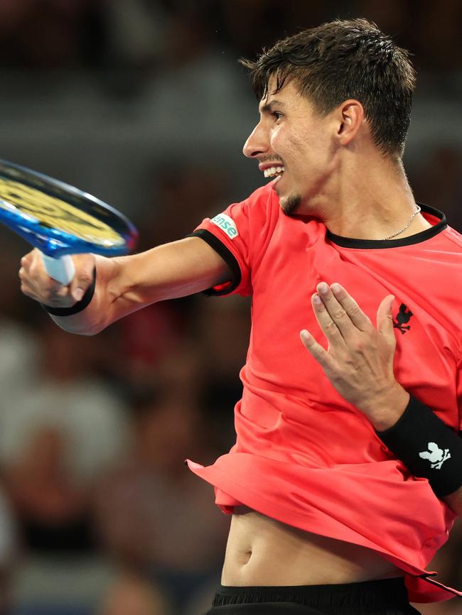 Alexei Popyrin strikes a forehand during his first-round loss. Picture: Kelly Defina/Getty Images