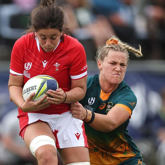 Wales' Sioned Harries (L) is tackled by Australia's Arabella Mckenzie.