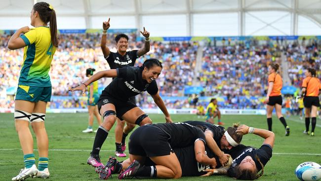 New Zealand’s Kelly Brazier is congratulated by team mates after scoring the winning try in the Women's Gold Medal Rugby Sevens Match. Picture: Getty