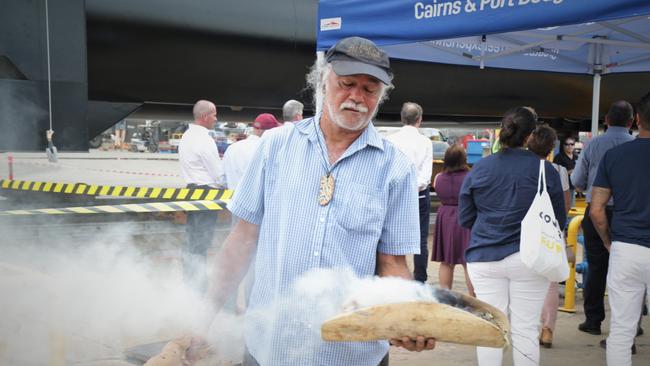 Henry Fourmile performs a traditional smoking ceremony for a new outer Reef pontoon called Remora. Picture: Peter Carruthers