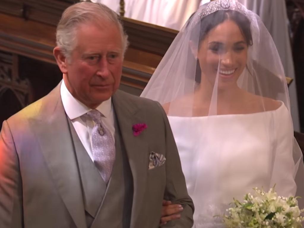 Britain's Prince Charles, Prince of Wales walks Meghan down the aisle. Picture: BBC