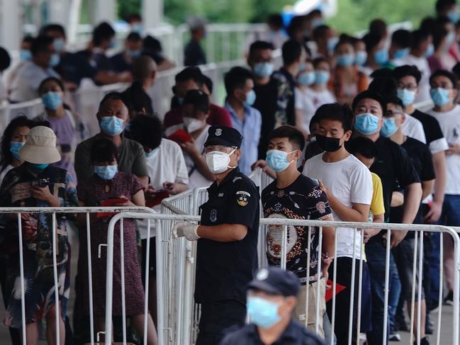 People who’ve had contact with the Xinfadi Wholesale Market line up for a COVID-19 test in Beijing. Picture: Getty Images