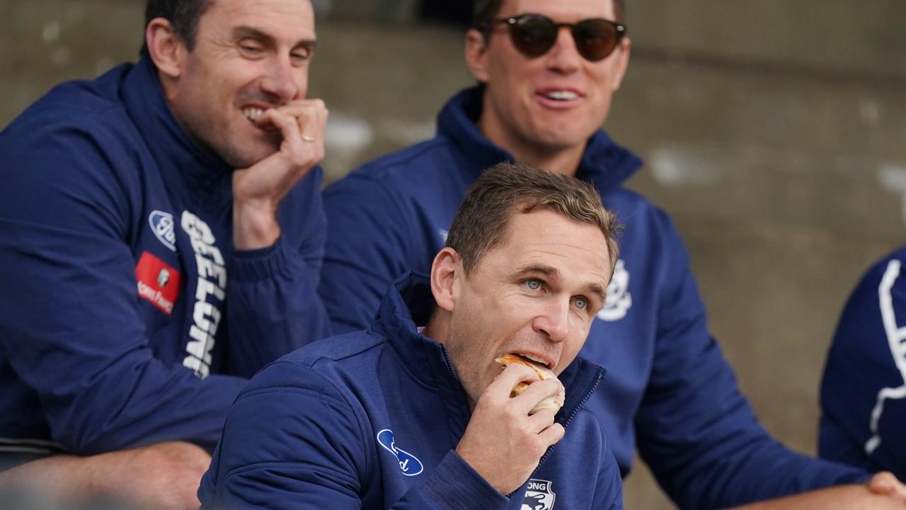 Joel Selwood tucks into a burger in the crowd in Colac ahead of Geelong’s pre-season game against Essendon.