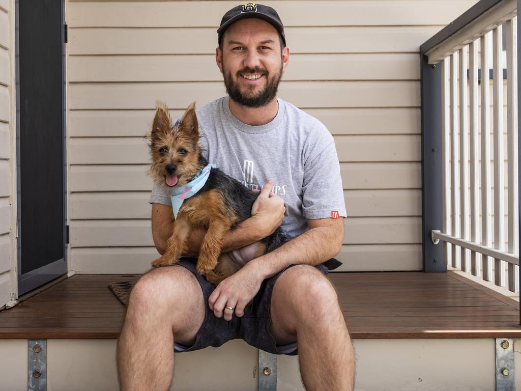 Brock Taylor with his Australian Terrier dog Stringer. Brock rang the Animals Poisons Hotline after Stringer ate Voltaren tablets and needed urgent veterinary treatment. Picture: Mark Cranitch.