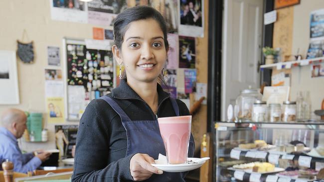 Neela Mbika serving a Beetroot Latte at the Macquarie Food Store. Picture: MATHEW FARRELL