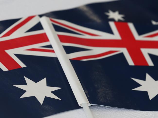 Australian flags were plentyful at the Australia Day citizenship ceremony. PICTURE: BRENDAN RADKE