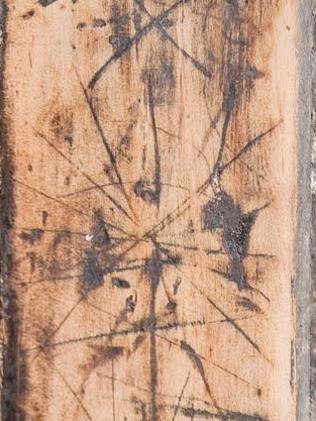 These witch marks or merels were scratched onto an old inn at Lewisham, near Hobart. Picture: Steve Dunbar.