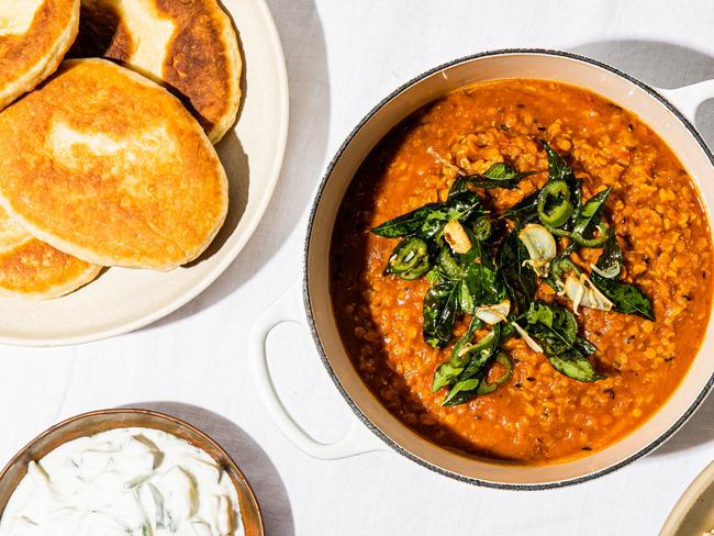 EMBARGO FOR TWAM 27 MAY 2023. FEE MAY APPLY. Dahl with crispy topping of fried curry leaves, garlic and chilli, Yoghurt flatbreads recipe by Elizabeth Hewson. Incidental is curry leaves TWAM exclusive. Photo: Nikki To