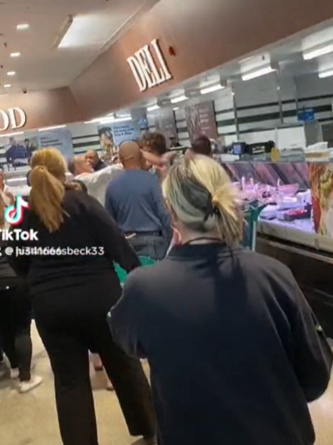 A fight broke out in the deli section of a Woolworths. Picture: TikTok