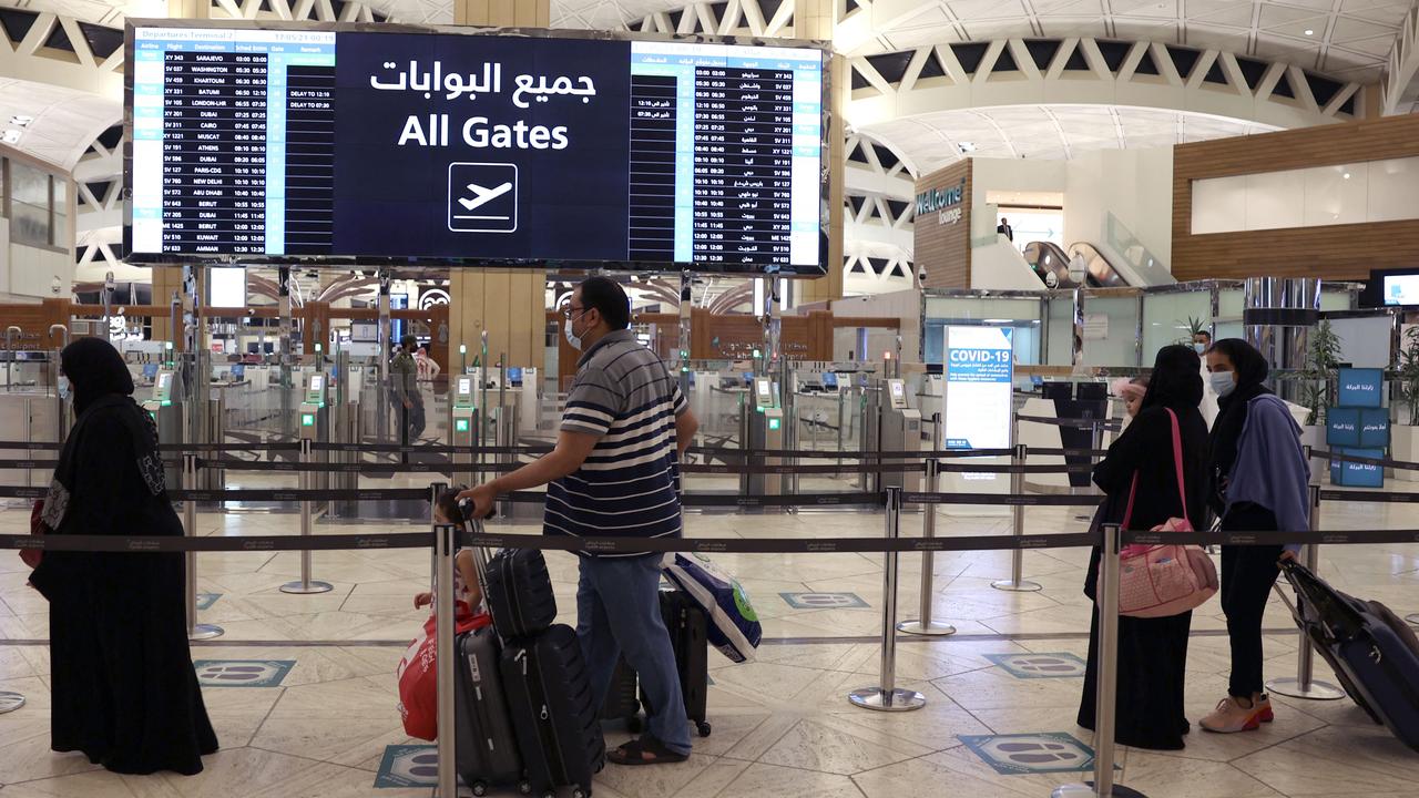 Saudi passengers arrive to King Khaled International Airport after authorities lift travel restrictions for citizens immunised against COVID-19. Picture: Fayez Nureldine/AFP