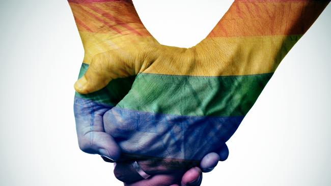 closeup of a gay couple holding hands, patterned as the rainbow flag