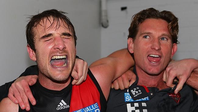 June 27, 2013: Jobe Watson and James Hird sing the club song after a stirring win over West Coast at Patersons Stadium. Picture: Paul Kane/Getty