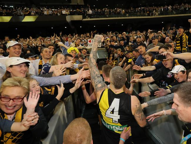 Dustin Martin celebrates as he walks off the field. Picture: Alex Coppel