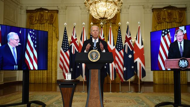 US President Joe Biden with British Prime Minister Boris Johnson (R) and Australian Prime Minister Scott Morrison.