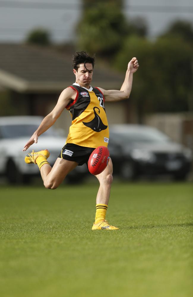 Lachie McDonnell takes a kick against Oakleigh Chargers.