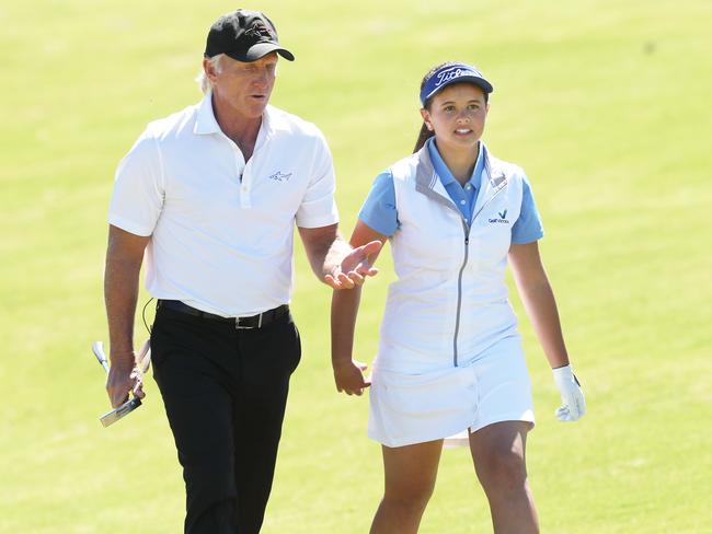 Greg Norman with young golfer Bannan. Picture: David Crosling