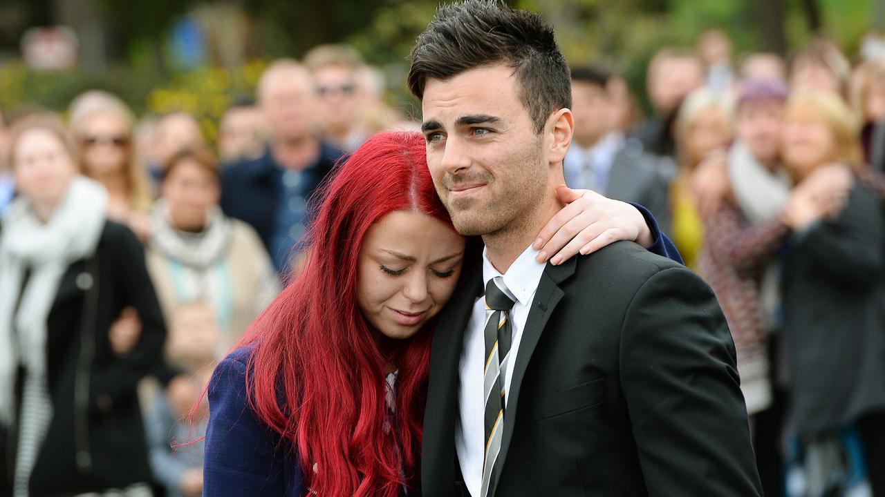 Vanessa and James Rizk mourn their parents at a memorial service for victims of the MH17 plane disaster, Picture: Carmelo Bazzano.