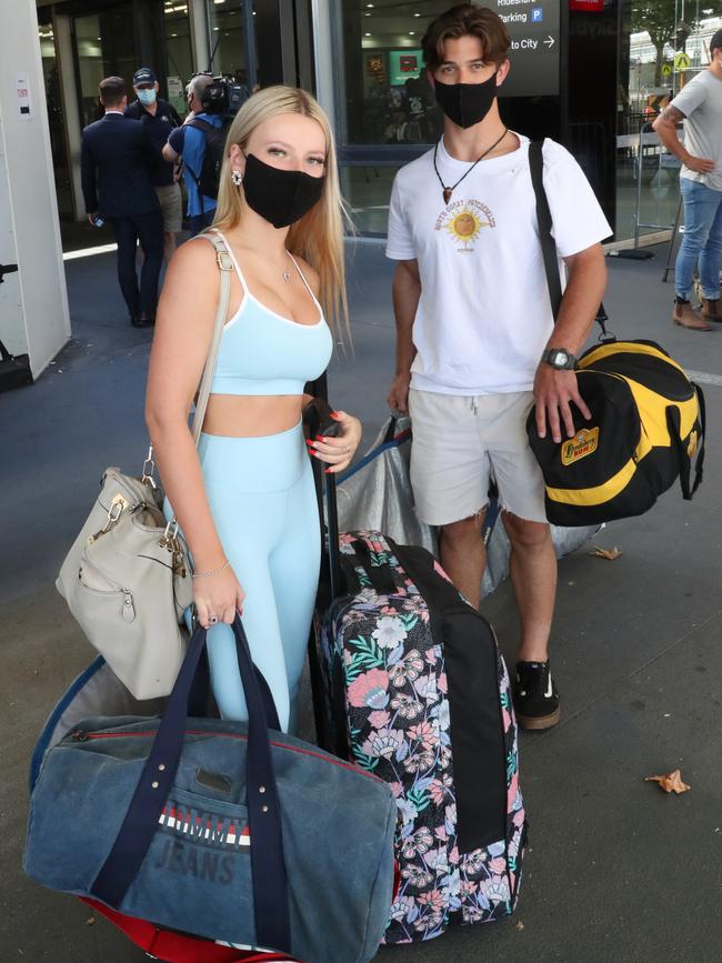 Zali McKinnar and Eli Salthouse at Melbourne Airport after their Brisbane flight. Picture: David Crosling