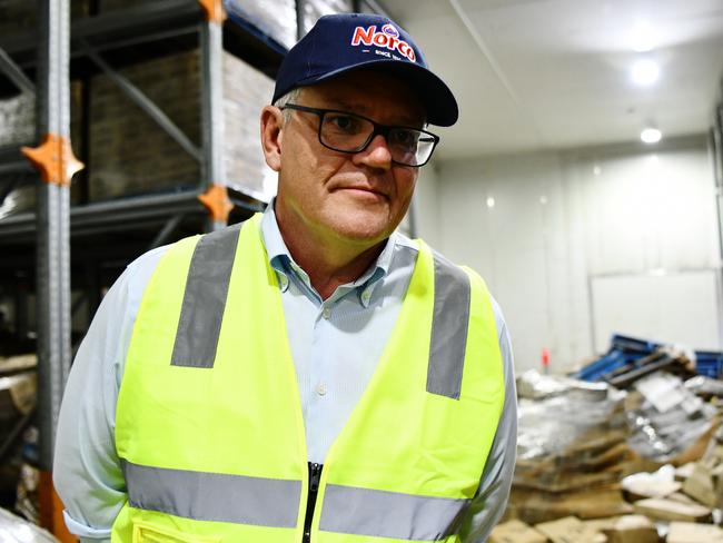 LISMORE, AUSTRALIA - NewsWire Photos - MARCH 09 2022:  Australian Prime Minister Scott Morrison visits the Norco Ice Cream factory in the flood affected town of Lismore in northern NSW March 9 2022. Pictured with Norco CEO Michael Hampson. Picture: NCA NewsWire/Elise Derwin