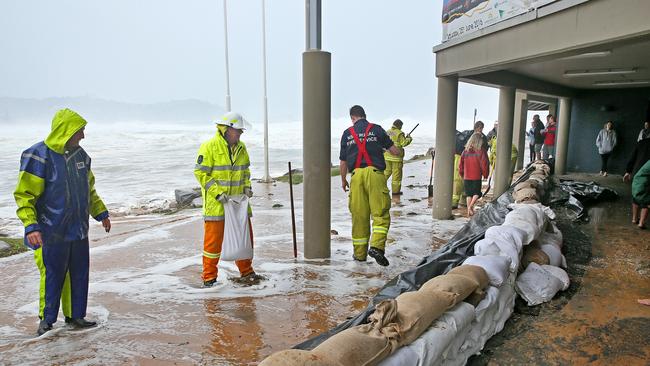 Sandbags were laid to protect the Avoca Beach Surf Club and cafe on Sunday as the storm swell threatened to flood them. The club did not sustain major damage. Picture: Troy Snook