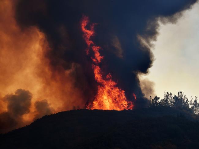 A bushfire tearing through California last month. Scientists say climate change will bring more bushfires. Picture: Mark Ralston