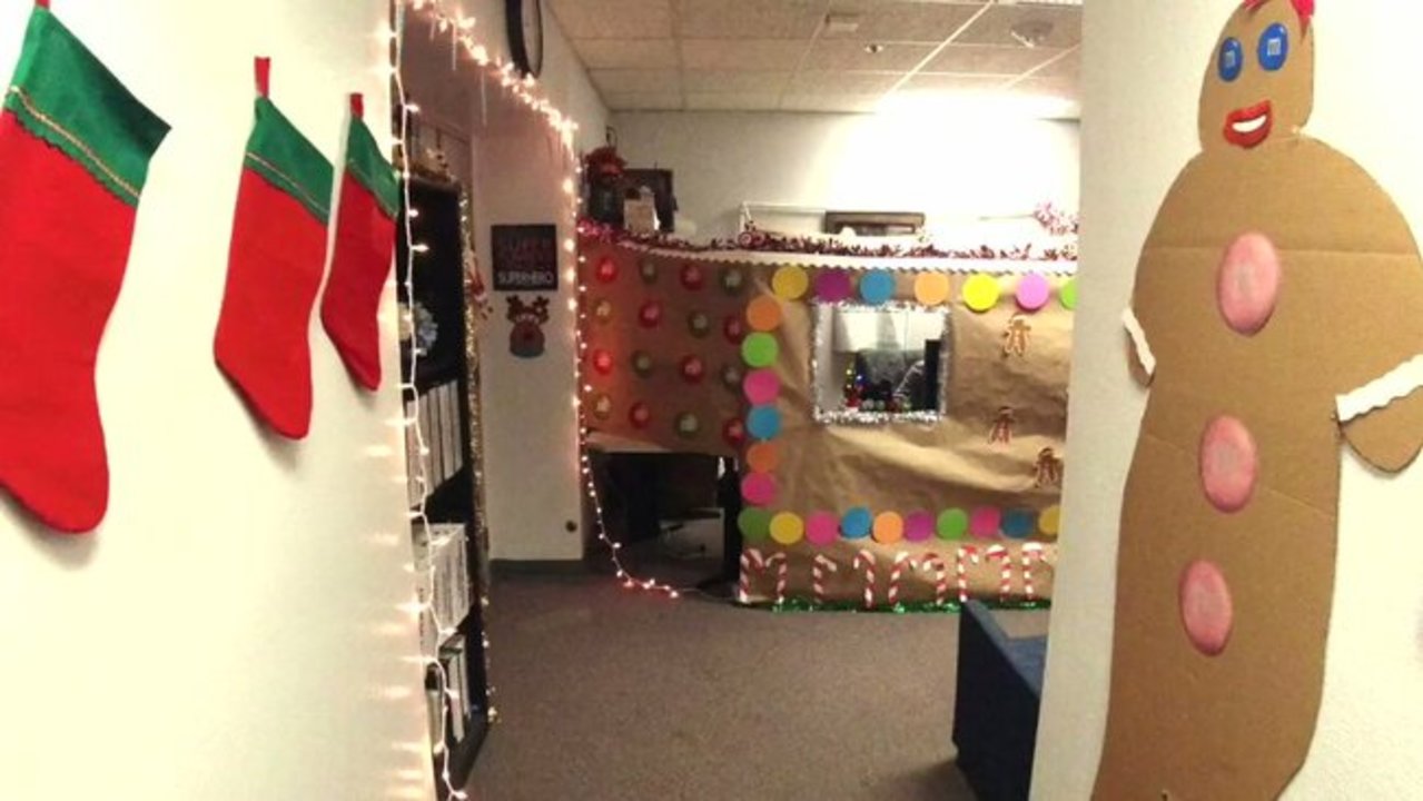 An employee of the San Diego Police Department took the Christmas spirit to a new level by constructing a life-sized gingerbread house around their desk. The police department shared a video of the gingerbread house, which wrapped around the employee’s desk and was covered with colorful button and candy cane decorations. The ‘house’ featured two tinsel-lined windows through which the employee could communicate with colleagues, complete with a mail box sign underneath one of the windows. “One of our employees in communications decided to celebrate the holiday season by decorating her entire cubical as a life sized gingerbread house!” the police department said. “Unfortunately, the walls are not edible.” Credit: San Diego Police Department via Storyful