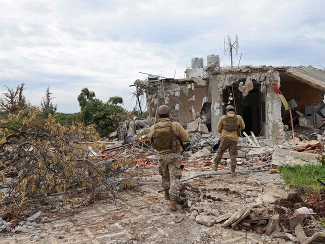 Lebanese soldiers patrol along a residential area that was devastated by the war between Israel and Hezbollah. Picture: AFP