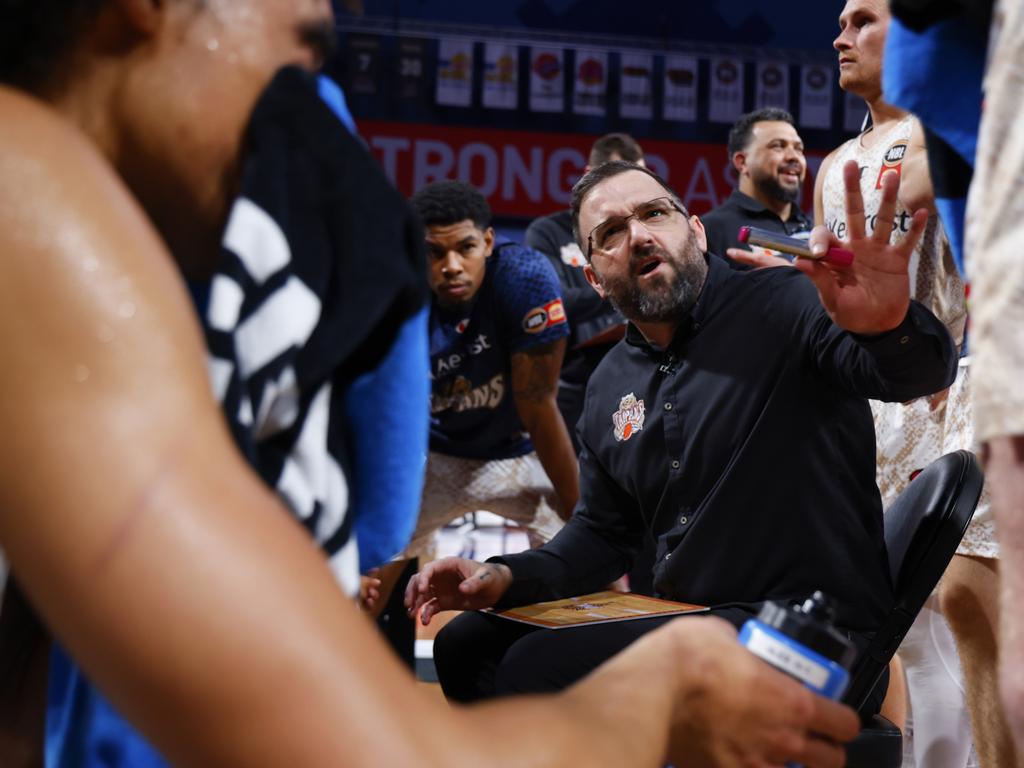 Adam Forde Head Coach of the Taipans talks to his players during a time-out during the round 18 NBL match between Perth Wildcats and Cairns Taipans at RAC Arena, on January 25, 2025, in Perth, Australia. (Photo by James Worsfold/Getty Images)