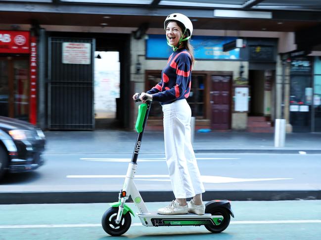 Victoria Read with a Lime E-Scooter which she thinks should be made Legal so people can commute to work on them. Picture: Tim Hunter.