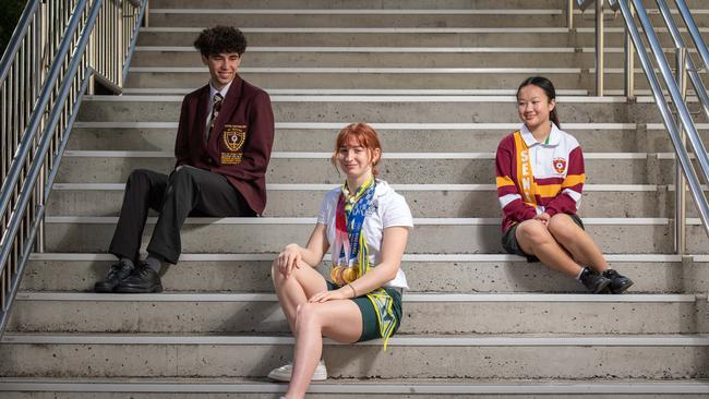 23-08-2021 Swimmer Mollie O'Callaghan back to school at St Peters Lutheran returning from the Olympics with 2 Gold and a Bronze medal. With school mates Daniel Storey and Minh-ai Pham. PICTURE: Brad Fleet