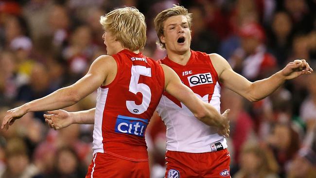 Brandon Jack celebrates a goal with Isaac Heeney.