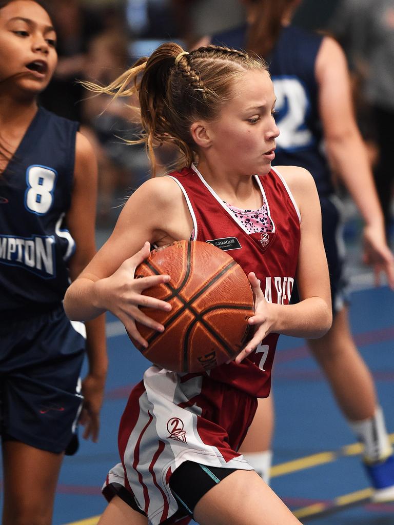 Belle Caughley drives in for a layup.