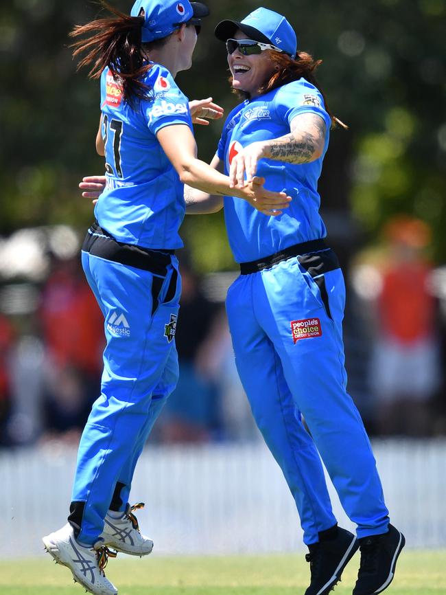 Megan Schutt (left) and Sarah Coyte (right) of the Strikers celebrate winning the WBBL match between the Adelaide Strikers and the Hobart Hurricanes at Allan Border Field. Picture: AAP