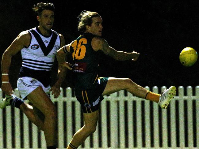 Brock McLennan gets a kick away for Northcote Park. Picture: Hamish Blair